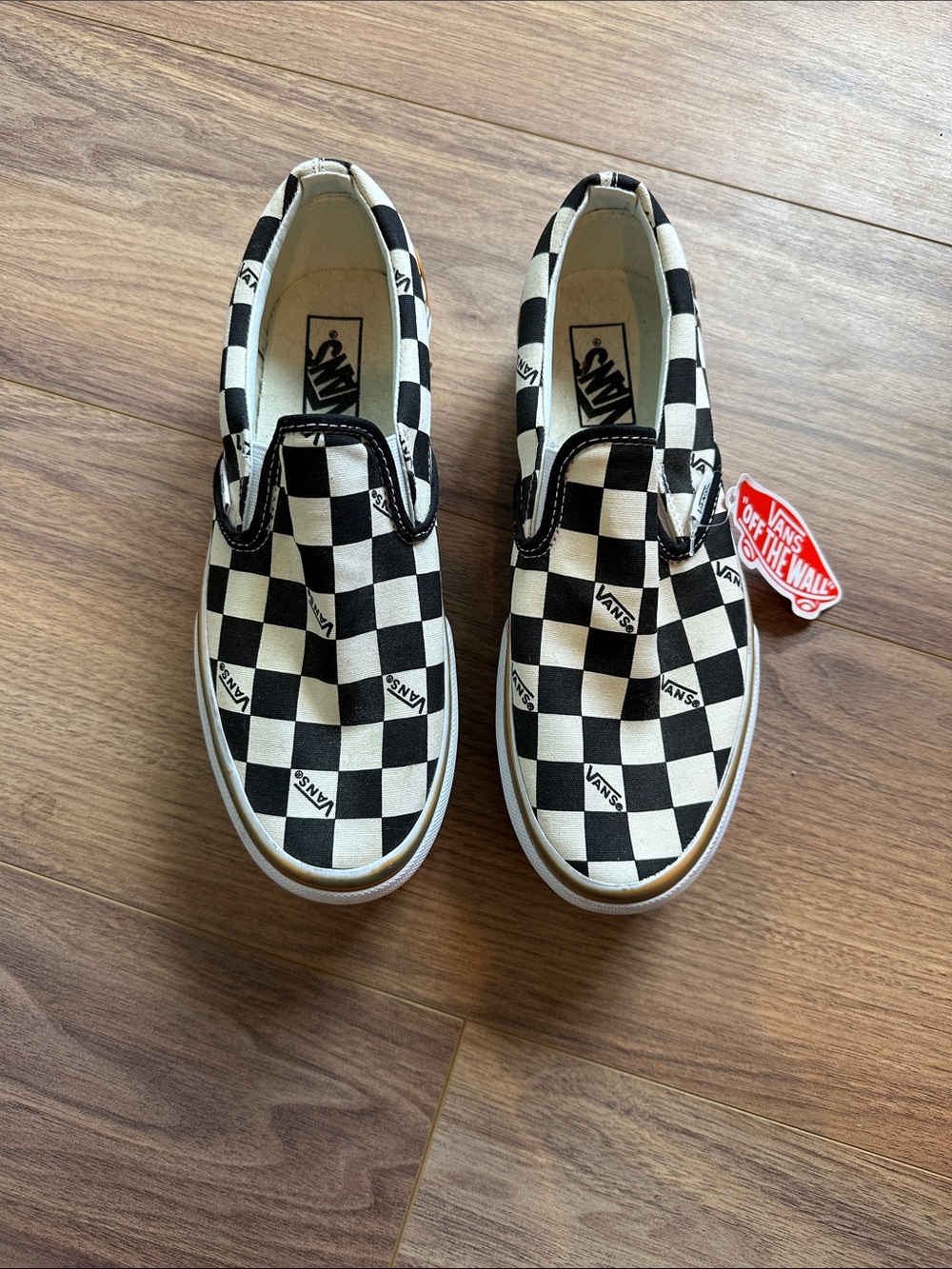 Vans Black & White Checkerboard Slip-On Sneakers